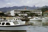 French Polynesia, boats docked in harbor across from Donald department store in Papeete