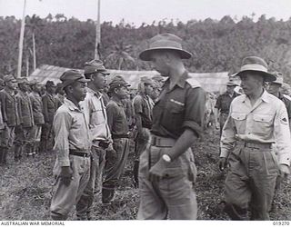 Muschu Island, New Guinea. 1945. Australian Army Officers, including medical officers, on the island inspecting and counting the Japanese troops, after their surrender