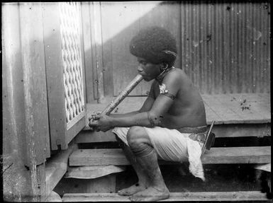 Tom from Goodenough Island smoking, Port Moresby, Papua, 1921, 2 / Sarah Chinnery