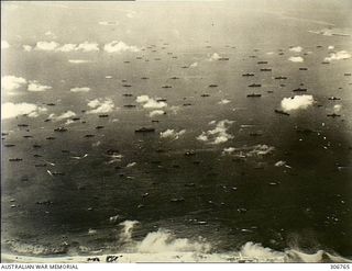 Ulithi Atoll, Caroline Islands. c. 1944-12. Aerial view of an extraordinary concentration of US Navy ships at anchor in the lagoon. There are at least eight Essex class carriers, three Independence ..