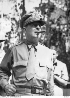 New Guinea. 1942-10-12. Informal portrait of US Army General Douglas MacArthur, cigar in mouth, during a visit to Australian troops operating in forward areas in New Guinea