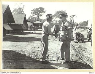 BOUGAINVILLE. 1945-03-27. GENERAL SIR THOMAS A. BLAMEY, COMMANDER-IN-CHIEF, ALLIED LAND FORCES, SOUTH WEST PACIFIC AREA (2), BEING MET BY COLONEL J. LEAH, OFFICER COMMANDING 2/1 GENERAL HOSPITAL ..