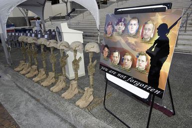 Friends and family of the fallen US Navy (USN) Sailors assigned to SEAL Delivery Vehicle Team One (SDVT-1) and the US Army (USA) Soldiers from the 160th Special Operations Aviation Regiment (SOAR) (Airborne), gather at the National Memorial Cemetery of the Pacific to pay tribute to their brothers, fathers, husbands, uncles, and friends lost in support of the Global War on Terrorism (GWOT). The 16 US troops were killed when their US Army (USA) MH-47D Chinook helicopter was shot down while trying to reinforce a US reconnaissance team in Afghanistan