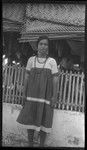 Girl in front of house