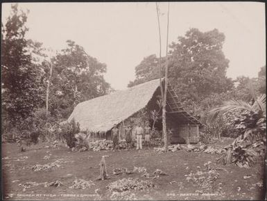Four men standing outside the church at Toga, Torres Islands, 1906 / J.W. Beattie