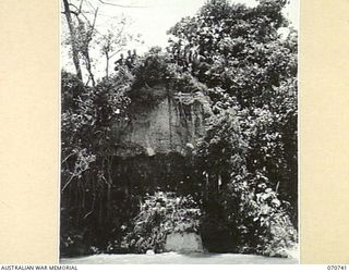 DALLMAN RIVER, NEW GUINEA, 1944-02-23. SURVEY MEN OF THE 2/14TH FIELD REGIMENT IN THEIR CAMP AREA, WITH THE DALLMAN RIVER IN THE FOREGROUND