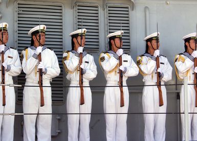 Chinese Peoples Liberation Army Navy Sailors from the Luhu (Type 052) Class Guided Missile Destroyer QINGDAO (DDG 113) stand in formation while holding their 7.62 mm Type 56 rifle as they depart Naval Station Pearl Harbor, Hawaii, on Sept. 10, 2006 after Goodwill Visit. The visit provides an excellent opportunity to enhance cooperation between the two navies and underscores the United States commitment to supporting ongoing cooperative efforts in the Pacific Region. (U.S. Navy photo by CHIEF Mass Communication SPECIALIST David Rush) (Released)