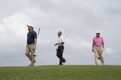 Barack Obama plays golf with Prime Minister Najib Razak, Joe Paulsen, and Mike Brush in Kaneohe Bay, Hawaii, December 24, 2014