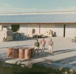 Pat Wilde, Roger Lee Larson, and a unidentified man on the Suva Harbor dock in, Fiji, during Leg IV of the Nova Expedition. August 1967