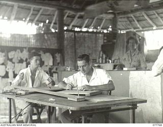 LAE, NEW GUINEA. 1944-12-30. TWO MEMBERS OF THE AUSTRALIAN MILITARY FORCES AND A MEMBER OF THE RAAF WORKING IN THE AUSTRALIAN RED CROSS SOCIETY HANDICRAFTS ROOM AT THE 2/7TH AUSTRALIAN GENERAL ..