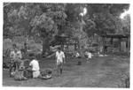 Groups with baskets of breadfruit?