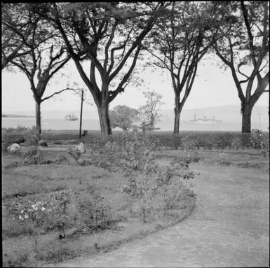 View across the Chinnery garden towards the harbour with two ships visible, Malaguna Road, Rabaul, New Guinea, ca. 1936 / Sarah Chinnery