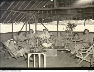 MADANG, NEW GUINEA. C. 1944-10. RAAF NURSING SISTERS RELAXING IN THEIR ANTE-ROOM ADJOINING THE MESS OF NORTHERN COMMAND RAAF AT A FORWARD BASE IN NEW GUINEA. LEFT TO RIGHT: 500440 SISTER M. RODDA, ..