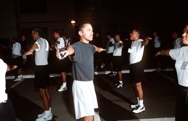 STAFF SGT. Emilio Maldonado Jr., a staff member of the Hawaii National Guard Youth Challenge program, is up at the crack of dawn teaching exercises to sleepy-eyed newcomers during the quasi-military residential phase. This federally funded program targets at-risk kids between 16 and 18 years old and tries to steer them away from trouble while they complete their high school requirements.(Published in AIRMAN Magazine May 1996 ) Exact Date Shot Unknown