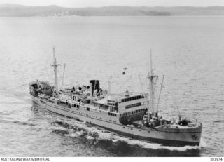 1940-04-22. AERIAL STARBOARD BOW VIEW OF THE AUSTRALIAN PASSENGER VESSEL MV MALAITA WHICH WAS TORPEDOED AND DAMAGED BY THE JAPANESE SUBMARINE RO-33 IN THE APPROACHES TO PORT MORESBY ON 1942-08-29. ..