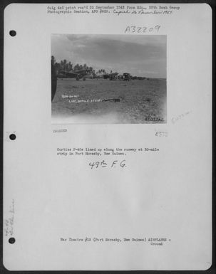 Curtiss P-40S Lined Up Along The Runway At 30-Mile Strip In Port Moresby, Papua, New Guinea. (U.S. Air Force Number 81072AC)