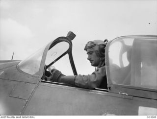 TOROKINA, BOUGAINVILLE ISLAND, SOLOMON ISLANDS. 1945-08-16. 402348 FLIGHT LIEUTENANT H. H. GRIFFITHS OF MOSMAN, NSW, MALAYA VETERAN, IN THE COCKPIT OF HIS BOOMERANG AIRCRAFT OF NO. 5 (TACTICAL ..