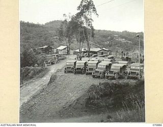 KIANDI, NEW GUINEA, 1944-02-25. HEADQUARTERS "A" AND "B" PLATOON OF THE 2/34TH GENERAL TRANSPORT COMPANY IN HUTS PREVIOUSLY FORMING THE POST OFFICE, GENERAL STORE AND HOTEL. THE PARKED JEEPS, ..