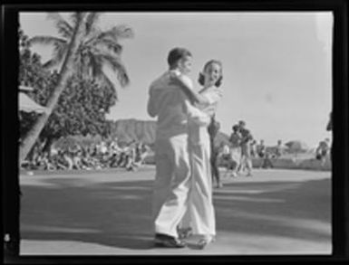 [Navy serviceman and woman dancing]