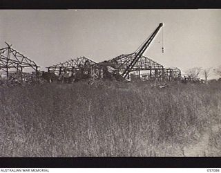 LAE, NEW GUINEA. 1943-09-19. BURNED OUT JAPANESE AIRCRAFT HANGARS WHICH WERE MADE SERVICEABLE SOON AFTER CAPTURE BY THE AUSTRALIAN TROOPS