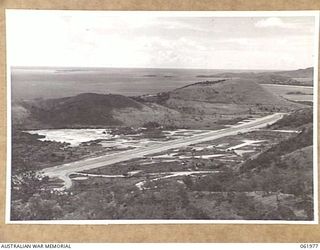 STOKES RANGE, PORT MORESBY AREA, NEW GUINEA. 1943-12-27. LOOKING DOWN ON KILA AERODROME FROM H8 HEAVY ANTI-AIRCRAFT GUN SITE, STOKES RANGE