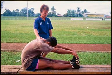 Young male athlete stretching,Tonga