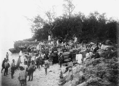 Group with crates of oranges, Mauke Island, Cook Islands