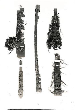 Photo of five wooden carvings; all with Tangaroa's head. (LXIII/2)