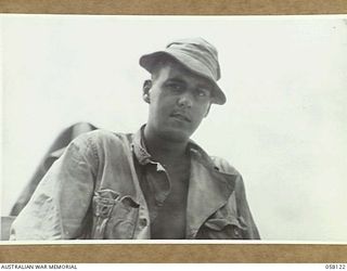 SALAMAUA, NEW GUINEA, 1943-09-26. 31289206 PRIVATE P.C. PAOLINO OF THE 542ND AMPHIBIAN ENGINEERS, UNITED STATES ARMY