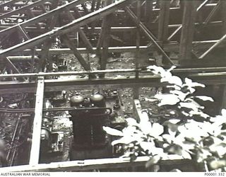 NEW BRITAIN, 1945-09. VIEW INTO A JAPANESE UNROOFED MACHINERY PLANT HUT NEAR RABAUL. (RNZAF OFFICIAL PHOTOGRAPH.)