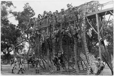 World War 2 New Zealand troops, climbing a rope ladder during amphibious training in New Caledonia