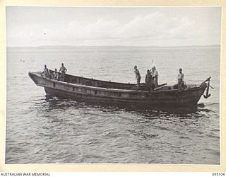 AT SEA, OFF BUIN, BOUGAINVILLE, 1945-08-20. WHILE THE JAPANESE ENVOY ON BOARD THE CORVETTE HMAS LITHGOW WAS CARRYING OUT SURRENDER NEGOTIATIONS, HIS JAPANESE BARGE CRUISED ROUND IN CLOSE VICINITY. ..