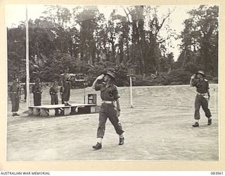 TOROKINA, BOUGAINVILLE, SOLOMON ISLANDS. 1944-12-15. LIEUTENANT COLONEL N.L. GOBLE, COMMANDING OFFICER 47 INFANTRY BATTALION (5), LEADING HEADQUARTERS COMPANY AND THE BATTALION DURING THE MARCH ..