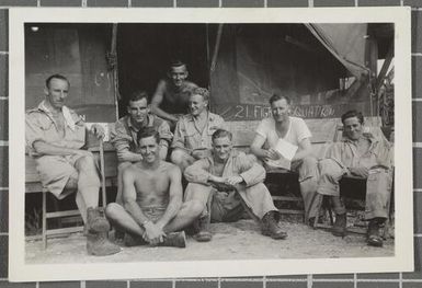 Group of RNZAF fighter pilots and their Squadron Intelligence Officer, Jacquinot Bay, New Britain