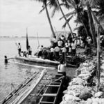 Coffin placed on canoe for trip to Pataliga