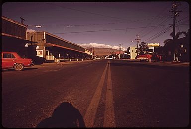 MAIN STREET OF KAUNAKAKAI, MOLOKAI'S PRINCIPAL TOWN, ON A SUNDAY AFTERNOON