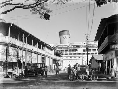 [View of buildings and a docked ship, the "Mariposa" likely Papeete, Tahiti]