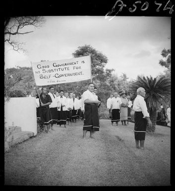 Members of the Mau, with placard in favour of self government, Apia, Western Samoa - Photograph taken by E S Andrews