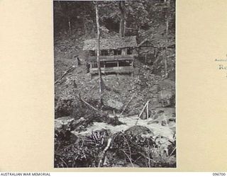 KAIRIRU ISLAND, NEW GUINEA. 1945-09-17. A TWO-TIERED HOUSE HIGH IN THE RANGES OF KAIRIRU, WHICH WAS THE HOME OF REAR-ADMIRAL S. SATO, FORMER JAPANESE NAVAL COMMANDER OF KAIRIRU AND MUSCHU ISLANDS. ..