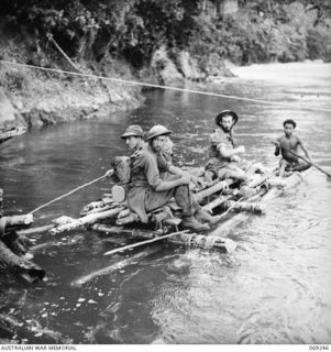 KALIKODOBU, NEW GUINEA. 1942-10. THE PARTY OF THE 2/14TH INFANTRY BATTALION ARRIVING AT THE UNITED STATES BASE CAMP. THESE MEN WERE CUT OFF FROM THE MAIN BODY OF TROOPS DURING THE WITHDRAWAL ACROSS ..