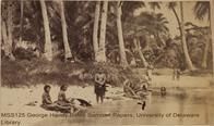 Samoan women at stream with "siapo" barkcloth boards.