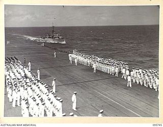 AT SEA OFF RABAUL, NEW BRITAIN. 1945-09-06. SAILORS FORMING ON THE FLIGHT DECK ABOARD THE AIRCRAFT CARRIER HMS GLORY BEFORE THE ARRIVAL OF GENERAL H. IMAMURA, COMMANDER EIGHTH AREA ARMY, TO SIGN ..