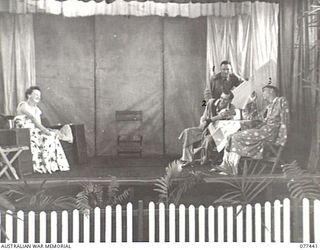 LAE BASE AREA, NEW GUINEA. 1944-12-01. MEMBERS OF THE ARMY EDUCATION SERVICE DRAMATIC GROUP ATTACHED TO THE 2/7TH AUSTRALIAN GENERAL HOSPITAL PLAYING IN NOEL COWARD'S PLAY "DESIGN FOR LIVING" IN ..