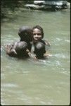 Girls swimming in the creek running by Uka'oi