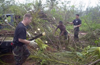 US Air Force (USAF) Airmen began the cleanup process at Andersen Air Force Base (AB), Guam, in the aftermath of Typhoon Chata'an. The typhoon created peak wind gusts of 104 miles per hour (mph), which scattered debris and trees causing damage to buildings, houses, and vehicles