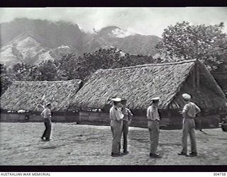 MOUNT STELLA, GOODENOUGH ISLAND, NEW GUINEA. 1944-01-09. ALLIED INTELLIGENCE BUREAU (AIB) PERSONNEL AT THE AIB STATION AT THE FOOT OF THE MOUNTAIN. LEFT TO RIGHT: SUB LIEUTENANT A. KIRKWALL-SMITH ..