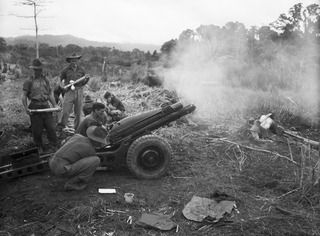 KIARIVU, NEW GUINEA, 1945-08-11. A 75MM GUN MANNED BY A BATTERY, 2/1 TANK ATTACK REGIMENT, ROYAL AUSTRALIAN ARTILLERY, WHO ARE SUPPORTING 2/7 INFANTRY BATTALION TROOPS DURING THEIR ATTACK AGAINST ..