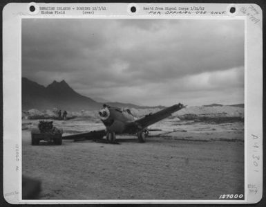 First Army Photos Of The Bombing Of Hickam Field, Hawaii, Dec. 7, 1941. Wrecked Pursuit Plane At Bellows Field, T.H. (U.S. Air Force Number 122060AC)