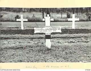 MILNE BAY, NEW GUINEA. 1944-07-19. THE GRAVE OF QX1071 CORPORAL J.A. FRENCH, VC, 2/9TH INFANTRY BATTALION IN THE MILNE BAY WAR CEMETERY