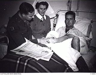 CONCORD, NSW 1945-08-15. LIEUTENANT-COLONEL D O BROWN, OFFICER COMMANDING 2/1 FACIA MAXILLARY PLASTIC SURGERY UNIT (1) AND SISTER J THOMAS AUSTRALIAN ARMY NURSING SERVICE (AANS) WITH PRIVATE C H ..